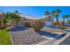 Charming single-story home featuring desert landscaping, a two-car garage, and a tile roof at 4653 Califa Dr, Las Vegas, NV 89122