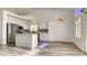 Kitchen featuring stainless steel appliances, an island with marble countertops and white cabinets at 4653 Califa Dr, Las Vegas, NV 89122