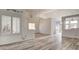 Open living space with new flooring, modern light fixtures, and lots of light at 4653 Califa Dr, Las Vegas, NV 89122