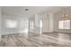 Spacious living room with modern floors, elegant chandeliers, and neutral paint at 4653 Califa Dr, Las Vegas, NV 89122