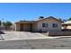 This single-story house has a covered carport with two large windows on the side of the house at 4748 Terra Linda Ave, Las Vegas, NV 89120