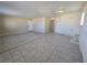 Open living room with tile floors, bright windows, and a doorway, providing space for living and entertaining at 4748 Terra Linda Ave, Las Vegas, NV 89120