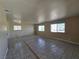 Spacious living room with tile floors, ample natural light, and neutral walls ready for customization at 4748 Terra Linda Ave, Las Vegas, NV 89120
