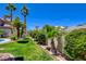 A lush green lawn and mature landscaping create a private backyard oasis at 4835 Willow Glen Dr, Las Vegas, NV 89147