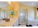Bright bathroom featuring a separate shower, large soaking tub, and double sinks at 4835 Willow Glen Dr, Las Vegas, NV 89147