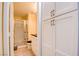 Cozy bathroom with a shower, vanity, and a storage cabinet in the hallway at 4835 Willow Glen Dr, Las Vegas, NV 89147
