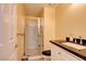 Bathroom featuring a glass-enclosed shower and granite countertop at 4835 Willow Glen Dr, Las Vegas, NV 89147