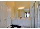 Full bathroom with a double sink vanity, glass shower, and a black and white floor at 4835 Willow Glen Dr, Las Vegas, NV 89147