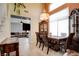 Charming dining area with modern lighting, and an adjacent living room with comfortable seating at 4835 Willow Glen Dr, Las Vegas, NV 89147