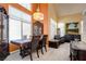 Well-lit dining room with stylish furniture, and large windows, perfect for Gathering gatherings at 4835 Willow Glen Dr, Las Vegas, NV 89147