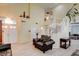 Bright living room with soaring ceilings, an open staircase, and lots of natural light at 4835 Willow Glen Dr, Las Vegas, NV 89147