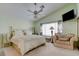 Comfortable bedroom with a vaulted ceiling, large window, and stylish furnishings at 4835 Willow Glen Dr, Las Vegas, NV 89147