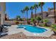 Relax by the sparkling pool surrounded by mature landscaping and towering palm trees at 4835 Willow Glen Dr, Las Vegas, NV 89147