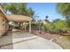 Spacious backyard featuring a covered patio and mature landscaping for outdoor enjoyment at 5529 Cranwood Ct, Las Vegas, NV 89130