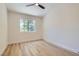 Bright bedroom filled with natural light, offering a calming retreat with wood-look floors at 5529 Cranwood Ct, Las Vegas, NV 89130