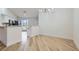 Bright dining room with new wood-look floors and an open view to the kitchen at 5529 Cranwood Ct, Las Vegas, NV 89130