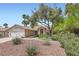 Lovely single-story home with a red tiled roof, beautiful landscaping and a two-car garage at 5529 Cranwood Ct, Las Vegas, NV 89130