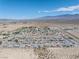 Scenic aerial view showcasing a desert community nestled near the mountains at 565 Mazelle Ln, Pahrump, NV 89060
