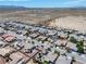 Aerial view of a neighborhood with well-maintained homes and desert surroundings at 565 Mazelle Ln, Pahrump, NV 89060