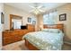 This carpeted bedroom is naturally lit and spacious with its many dressers at 565 Mazelle Ln, Pahrump, NV 89060