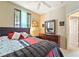 Cozy bedroom with a comfortable queen-sized bed and ample natural light at 565 Mazelle Ln, Pahrump, NV 89060