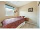 This carpeted bedroom features a ceiling fan and bright, natural light at 565 Mazelle Ln, Pahrump, NV 89060