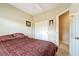 This bedroom features a ceiling fan, closet and an open entry at 565 Mazelle Ln, Pahrump, NV 89060