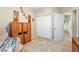 This carpeted bedroom features a closet, open entry, and plenty of storage at 565 Mazelle Ln, Pahrump, NV 89060