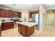 Spacious kitchen with stainless steel appliances, center island, and ample cabinet space at 565 Mazelle Ln, Pahrump, NV 89060