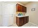 The laundry room features overhead cabinets and counter space at 565 Mazelle Ln, Pahrump, NV 89060