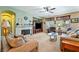 Comfortable living room with fireplace, neutral tones, and large windows at 565 Mazelle Ln, Pahrump, NV 89060