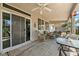 Covered patio area with ample seating and backyard access at 565 Mazelle Ln, Pahrump, NV 89060
