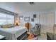 Cozy bedroom with a queen bed, colorful rug, and a bright window at 5831 Medallion Dr # 103, Las Vegas, NV 89122