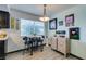 The bright dining area includes a cozy breakfast table with decor and artwork to add to the charm at 5831 Medallion Dr # 103, Las Vegas, NV 89122