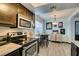 Bright kitchen with modern appliances, breakfast nook, and stylish decorative elements at 5831 Medallion Dr # 103, Las Vegas, NV 89122