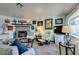 Bright living room featuring a cozy fireplace, comfortable seating, and modern décor at 5831 Medallion Dr # 103, Las Vegas, NV 89122