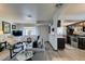 Open-concept living room showcasing seamless transition to the modern kitchen and dining areas at 5831 Medallion Dr # 103, Las Vegas, NV 89122