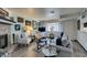 Well-lit living room features a cozy fireplace, plush seating, and tasteful decor at 5831 Medallion Dr # 103, Las Vegas, NV 89122