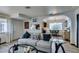 Comfortable living room with open layout to kitchen and dining, featuring stylish decor at 5831 Medallion Dr # 103, Las Vegas, NV 89122
