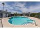 Community pool view, showcasing lounge chairs and shade, perfect for relaxation at 5831 Medallion Dr # 103, Las Vegas, NV 89122