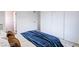 Comfortable bedroom with large sliding closet doors and a plush bed with decorative pillows at 6170 W University Ave, Las Vegas, NV 89103