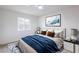 Inviting bedroom featuring a comfortable bed with a plush rug, side tables, and soft lighting at 6170 W University Ave, Las Vegas, NV 89103