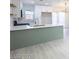 Open kitchen featuring white and green cabinets, stainless appliances, and a large island at 6170 W University Ave, Las Vegas, NV 89103