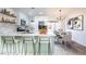 Bright kitchen featuring an island with bar seating and a dining area at 6170 W University Ave, Las Vegas, NV 89103