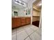 Bathroom with double sinks, a big mirror, and a walk-in closet at 6545 Netherseal Ave, Las Vegas, NV 89139