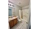 Bathroom featuring tiled floors and a shower-tub combo with curtain at 6545 Netherseal Ave, Las Vegas, NV 89139