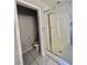 Bathroom featuring a walk-in shower, toilet, tile floors, and neutral walls at 6545 Netherseal Ave, Las Vegas, NV 89139