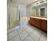 Bright bathroom featuring a double vanity, soaking tub, and glass shower at 6545 Netherseal Ave, Las Vegas, NV 89139