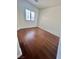 Bedroom featuring wood floors and natural light from a window at 6545 Netherseal Ave, Las Vegas, NV 89139