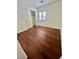 Well-lit bedroom featuring wood floors and a closet with sliding doors at 6545 Netherseal Ave, Las Vegas, NV 89139